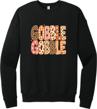 Gobble Gobble Patchwork crewneck sweatshirt in Black, featuring Gobble Gobble in bubble letters filled with leopard, gingham, checkerboard, stars, and pumpkin prints