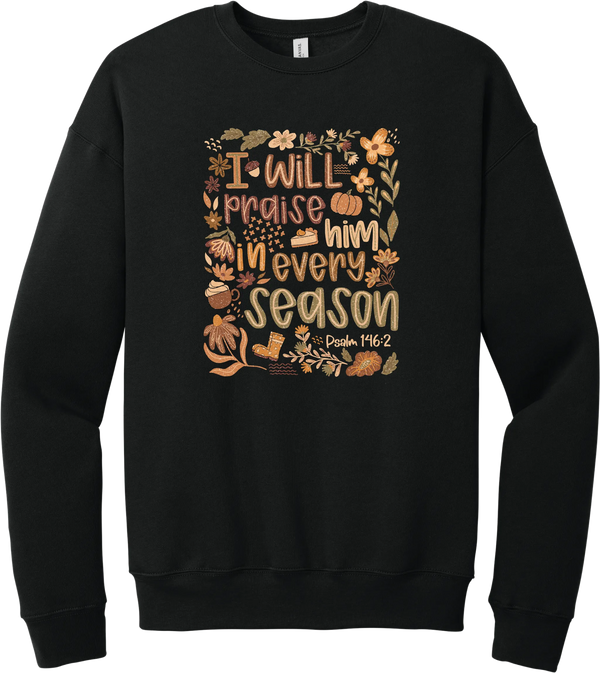 Praise Him Wildflower crewneck sweatshirt in Black, featuring I Will Praise Him in Every Season in hand lettering surrounded by fall wildflowers, pumpkins, a latte, boots, and Psalm 146:2