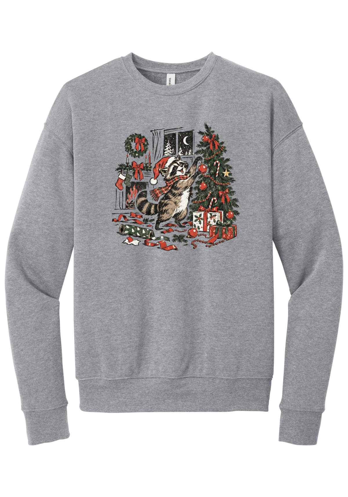 Raccoon Christmas crewneck sweatshirt in Athletic Heather, featuring a vintage-style raccoon in a Santa hat and plaid scarf decorating a Christmas tree by the fireplace with ribbon and gifts scattered around