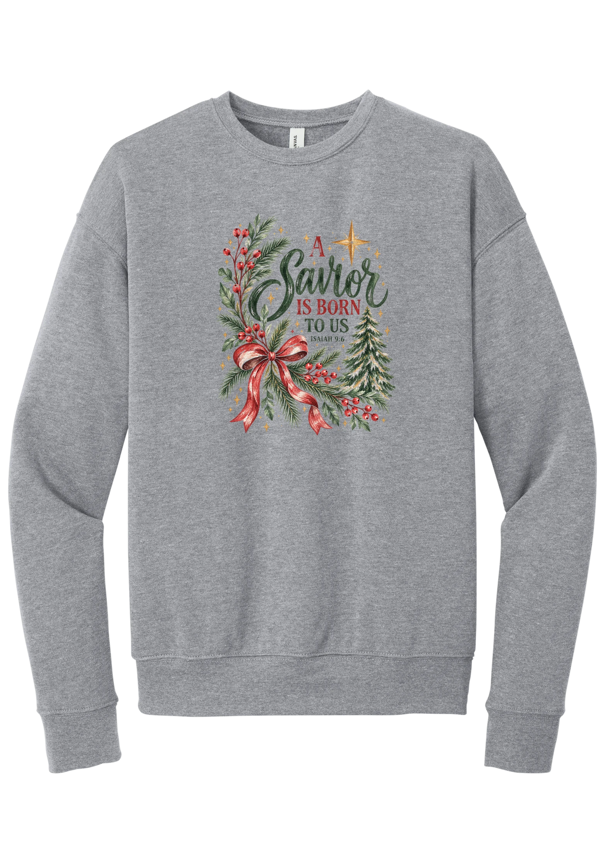 A Savior Is Born To Us crewneck sweatshirt in Athletic Heather, featuring watercolor evergreen and holly with a red ribbon bow, the words A Savior is born to us, and Isaiah 9:6