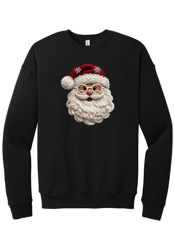 Crocheted Santa crewneck sweatshirt in Black, featuring a yarn-textured Santa face with a chunky cream beard, round glasses, and a red knit hat with snowflakes and a pom-pom