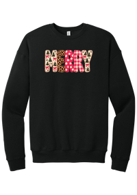 Merry Preppy Applique crewneck sweatshirt in Black, featuring faux applique MERRY letters in pink and green patchwork patterns with trees, gingham, Santas, polka dots, and candy cane stripes