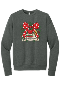 Merry Teachmas crewneck sweatshirt in Deep Heather, featuring a red polka dot bow over a stack of books reading Teach, Inspire, Change with an apple, pencils, evergreen, and a Merry Teachmas banner