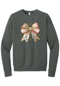Nativity Bow crewneck sweatshirt in Deep Heather, featuring a blush satin bow with painted nativity scenes in its ribbons and gold snowflakes