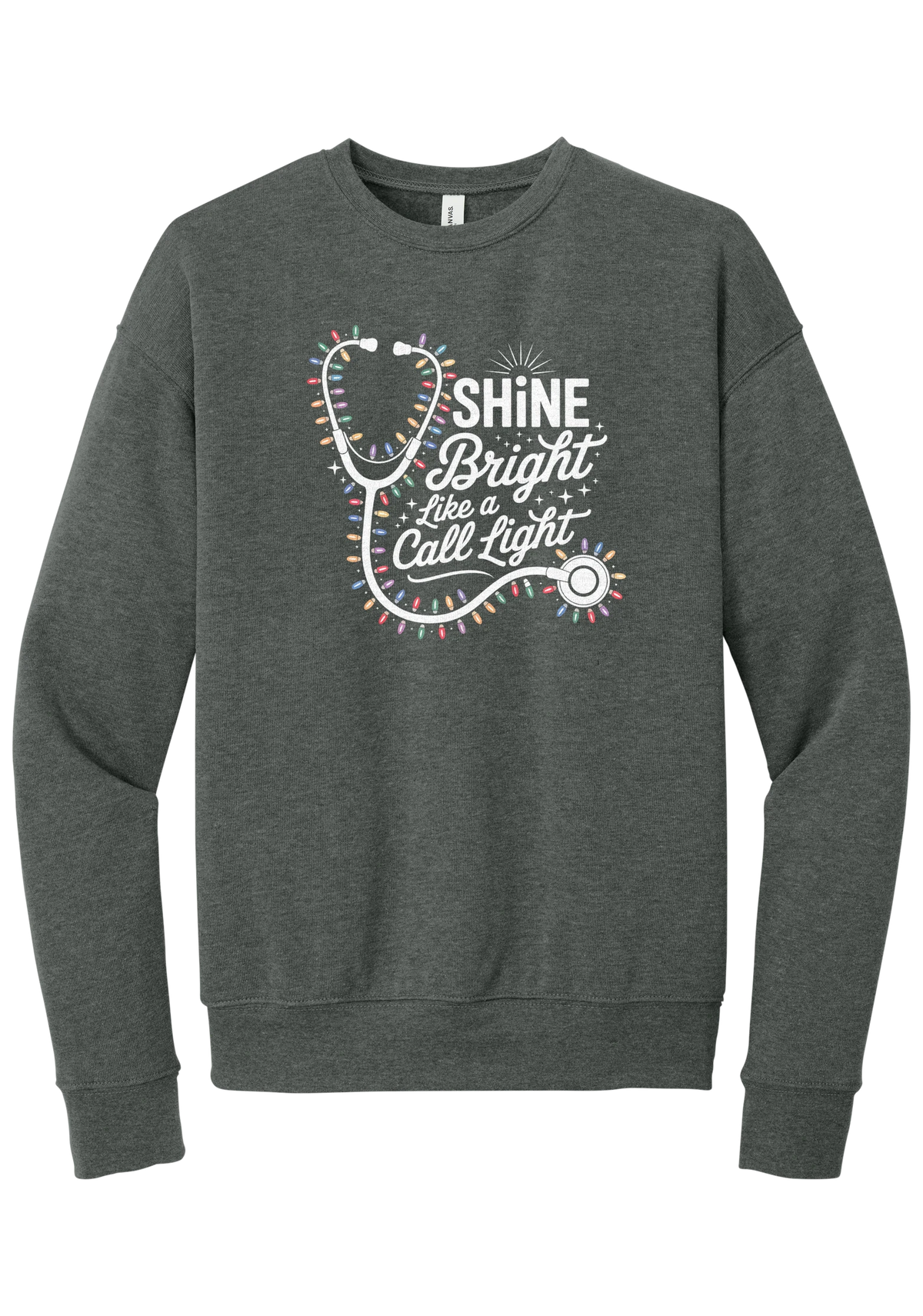 Shine Bright Like a Call Light crewneck sweatshirt in Deep Heather, featuring a white stethoscope wrapped in multicolor Christmas lights with Shine Bright Like a Call Light lettering and sparkles