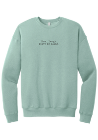 Live Laugh Leave Me Alone crewneck sweatshirt in Dusty Blue, featuring live. laugh. leave me alone. in distressed black typewriter letters