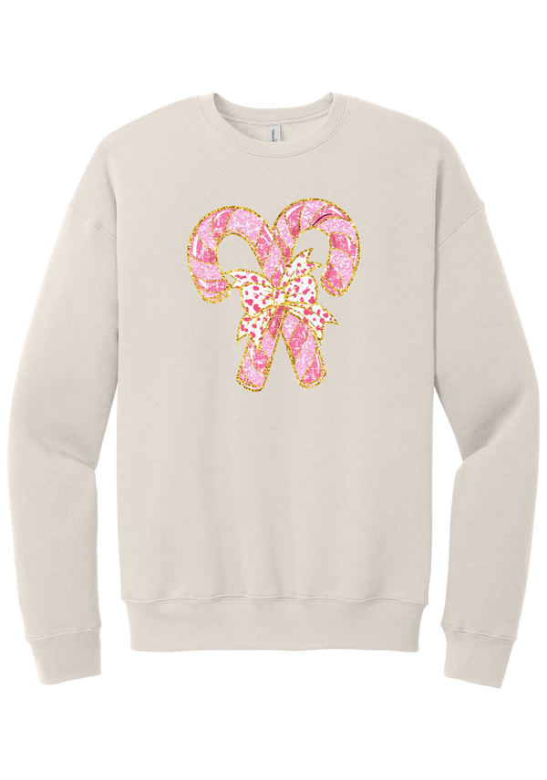 Candy Cane Bow crewneck sweatshirt in Heather Dust, featuring two pink glitter candy canes tied with a leopard heart bow and gold trim