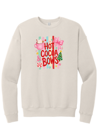Hot Cocoa and Bows crewneck sweatshirt in Heather Dust, featuring red HOT COCOA and BOWS letters on pastel stripes with a cocoa mug and a pink bow