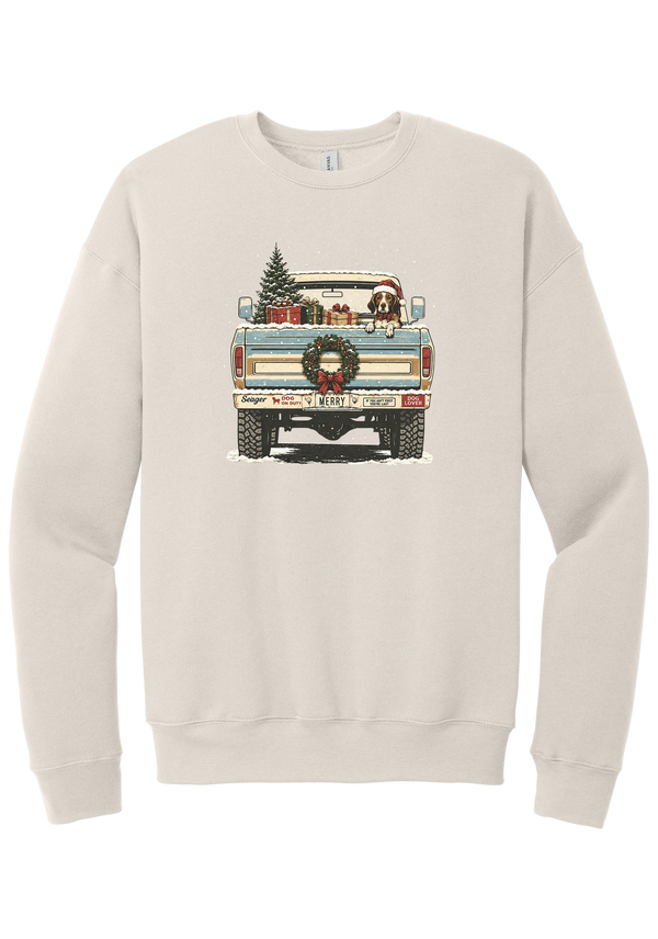 Christmas Pickup Truck with Dog crewneck sweatshirt in Heather Dust, featuring a vintage pickup truck with a Christmas tree, wrapped gifts, a tailgate wreath, and a dog in a Santa hat
