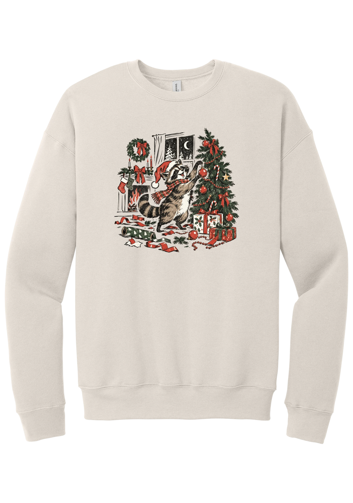 Raccoon Christmas crewneck sweatshirt in Heather Dust, featuring a vintage-style raccoon in a Santa hat and plaid scarf decorating a Christmas tree by the fireplace with ribbon and gifts scattered around