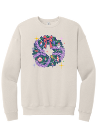 Retro Wreath crewneck sweatshirt in Heather Dust, featuring a retro tinsel Christmas wreath with vintage ornaments and a red bow