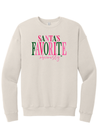 Santa's Favorite, Obviously crewneck sweatshirt in Heather Dust, featuring SANTA'S FAVORITE in pink and green serif lettering with a pink script obviously and a green snowflake