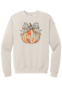 Thankful Pumpkin Bow crewneck sweatshirt in Heather Dust, featuring a painted pumpkin with a spotted bow and thankful in gold glitter script