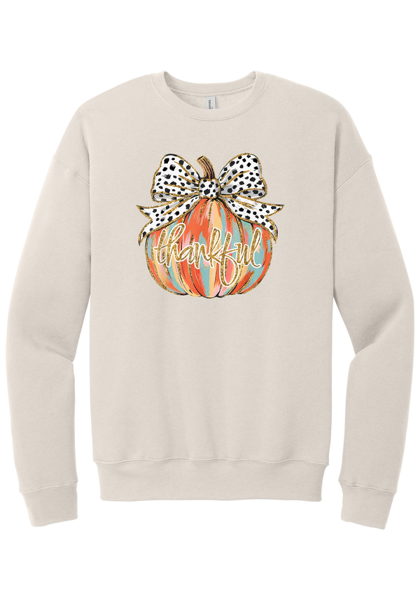 Thankful Pumpkin Bow crewneck sweatshirt in Heather Dust, featuring a painted pumpkin with a spotted bow and thankful in gold glitter script