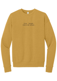 Live Laugh Leave Me Alone crewneck sweatshirt in Heather Mustard, featuring live. laugh. leave me alone. in distressed black typewriter letters