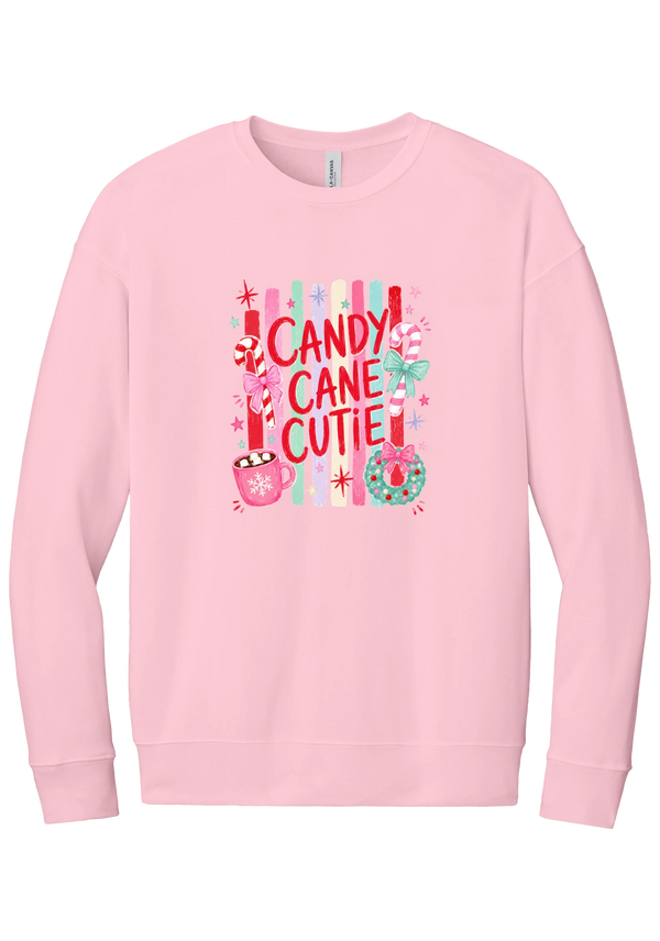 Candy Cane Cutie crewneck sweatshirt in Pink, featuring red CANDY CANE CUTIE letters on pastel stripes with candy canes, cocoa, and bows