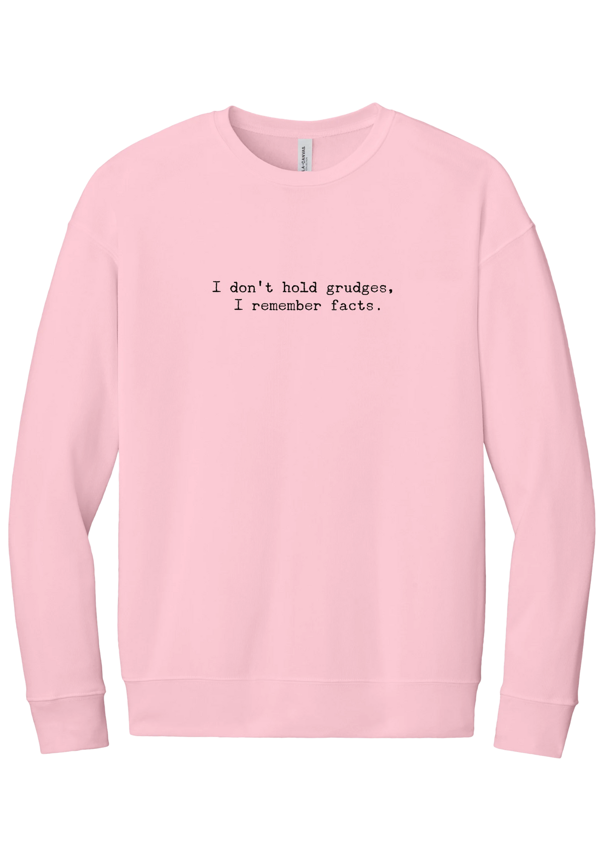 I Don't Hold Grudges crewneck sweatshirt in Pink, featuring I don't hold grudges, I remember facts in distressed black typewriter letters