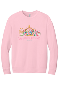 The Greatest Gift of All crewneck sweatshirt in Pink, featuring a pastel watercolor nativity scene under the star with The Greatest Gift of All script and Matthew 1:21