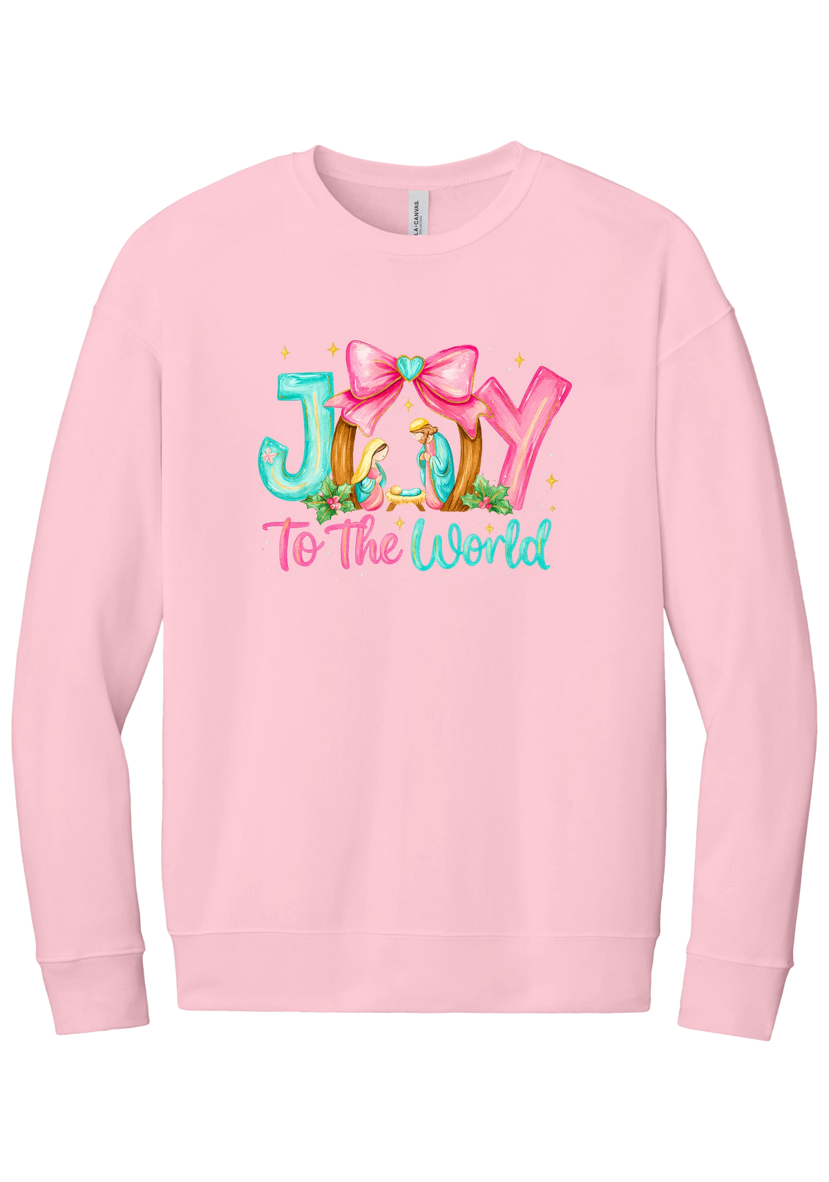 Joy to the World Nativity crewneck sweatshirt in Pink, featuring painted JOY letters framing a nativity scene with a pink bow and To The World script
