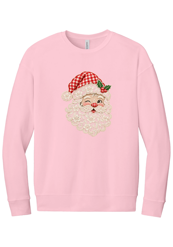 Vintage Lace Santa crewneck sweatshirt in Pink, featuring a winking Santa face in a vintage lace-look print with a cream floral beard, red gingham hat, and holly