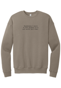 Not Worth Jail Time crewneck sweatshirt in Tan, featuring Sometimes I have to tell myself it's not worth jail time in distressed black typewriter letters