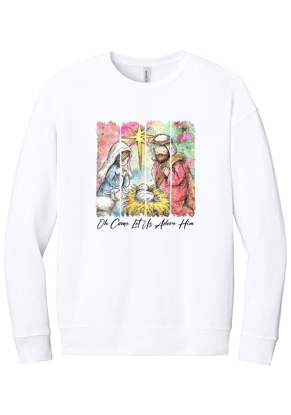 Adore Him Painted Nativity crewneck sweatshirt in White, featuring a watercolor nativity of Mary, Joseph, and baby Jesus under a star with Oh Come Let Us Adore Him script