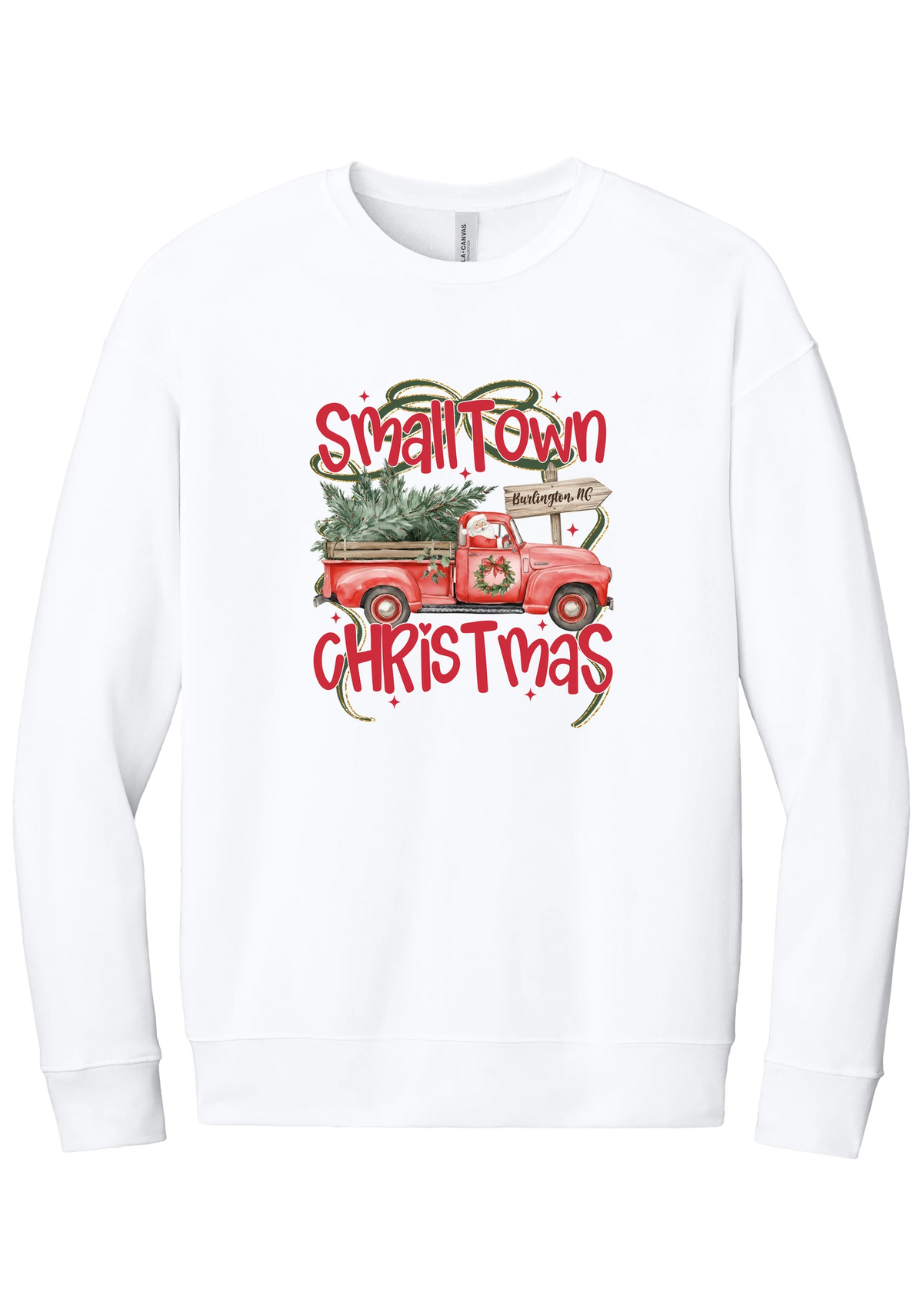 Personalized Small Town Christmas crewneck sweatshirt in White, featuring Santa in a vintage red pickup truck hauling a Christmas tree past a personalized town road sign, with red Small Town Christmas lettering