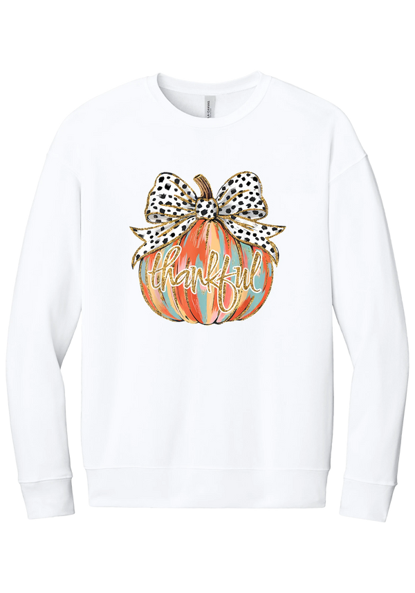 Thankful Pumpkin Bow crewneck sweatshirt in White, featuring a painted pumpkin with a spotted bow and thankful in gold glitter script