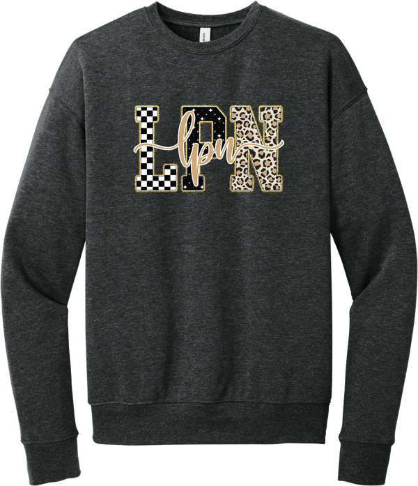 Glitzy Patterned LPN crewneck sweatshirt in Dark Grey Heather, featuring LPN block letters in checkerboard, sparkle star, and leopard patterns with a gold glitter outline and lpn script