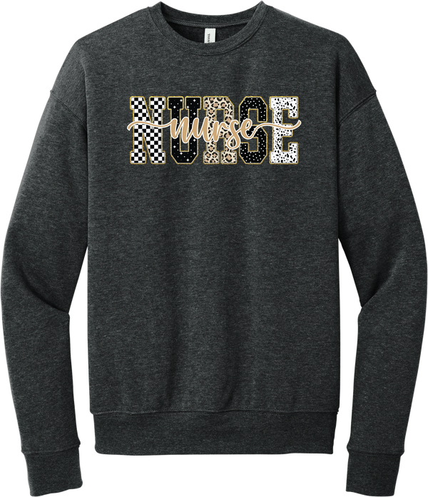 Glitzy Patterned Nurse crewneck sweatshirt in Dark Grey Heather, featuring NURSE block letters in checkerboard, leopard, and polka dot patterns with a gold glitter outline and nurse script