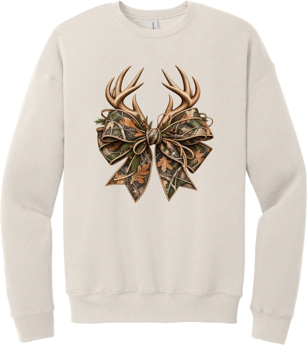 Coquette Antlers crewneck sweatshirt in Heather Dust, featuring deer antlers tied with an oversized camo bow, twine, and autumn leaves