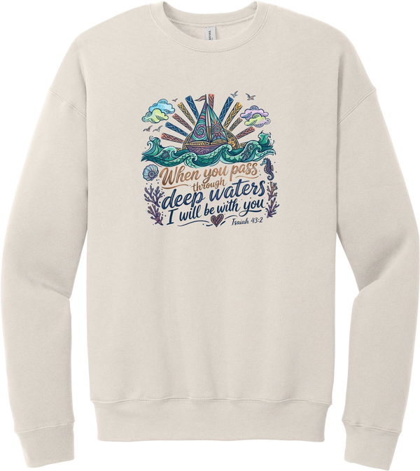 Deep Waters Folk Art crewneck sweatshirt in Heather Dust, featuring a folk art sailboat on swirling waves with a sunburst, seashells, and a seahorse above When You Pass Through Deep Waters I Will Be With You lettering and Isaiah 43:2