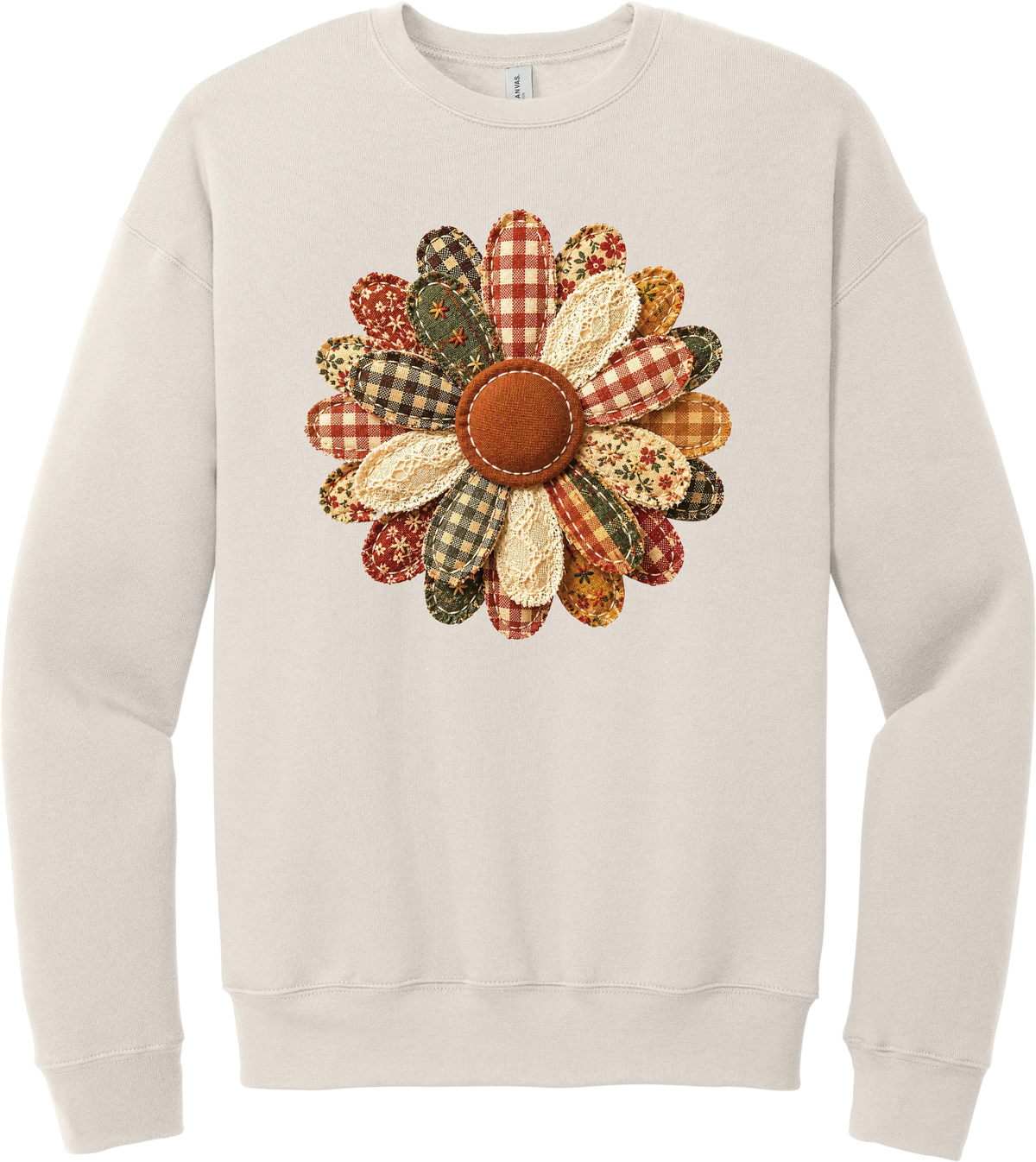 Patchwork Fabric Flower crewneck sweatshirt in Heather Dust, featuring an oversized fabric flower with plaid, gingham, calico, and cable knit petals around a stitched rust center
