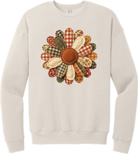 Patchwork Fabric Flower crewneck sweatshirt in Heather Dust, featuring an oversized fabric flower with plaid, gingham, calico, and cable knit petals around a stitched rust center