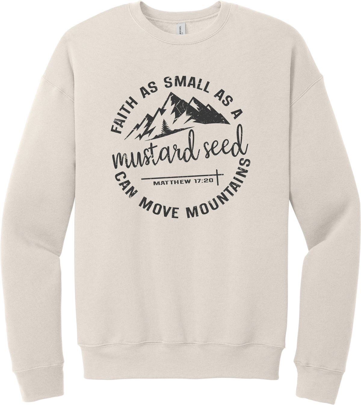 Mustard Seed Faith crewneck sweatshirt in Heather Dust, featuring a circle badge of mountains and a cross with Faith as Small as a Mustard Seed Can Move Mountains lettering and Matthew 17:20