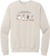Yes I'm a Nurse Goose crewneck sweatshirt in Heather Dust, featuring four nurse geese with a clipboard, stethoscope, coffee, and needle under Yes, I'm a nurse. No, I don't want to look at it.