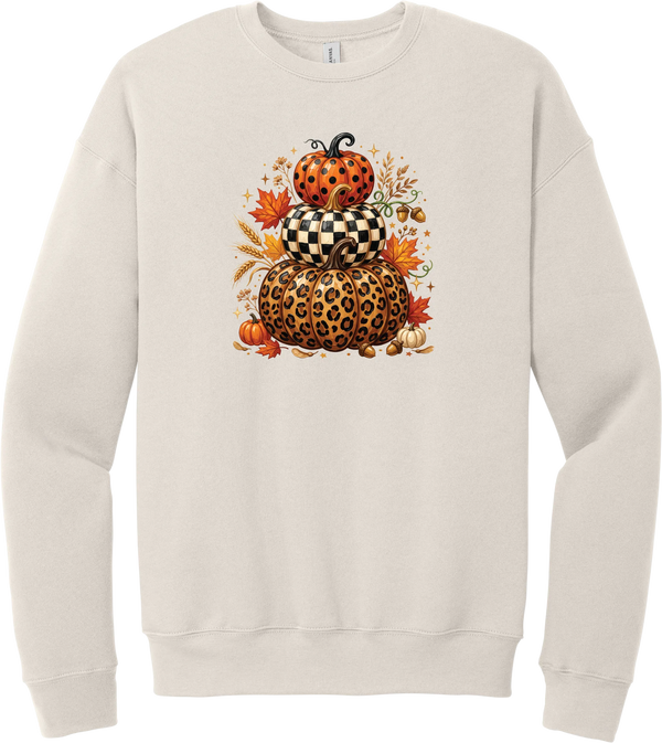 All Stacked Up crewneck sweatshirt in Heather Dust, featuring three stacked pumpkins in polka dot, checkerboard, and leopard with autumn leaves