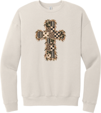 Quilted Patchwork Cross crewneck sweatshirt in Heather Dust, featuring a patchwork cross in camo, leopard, checkerboard, polka dot, and stripes with a fringed edge