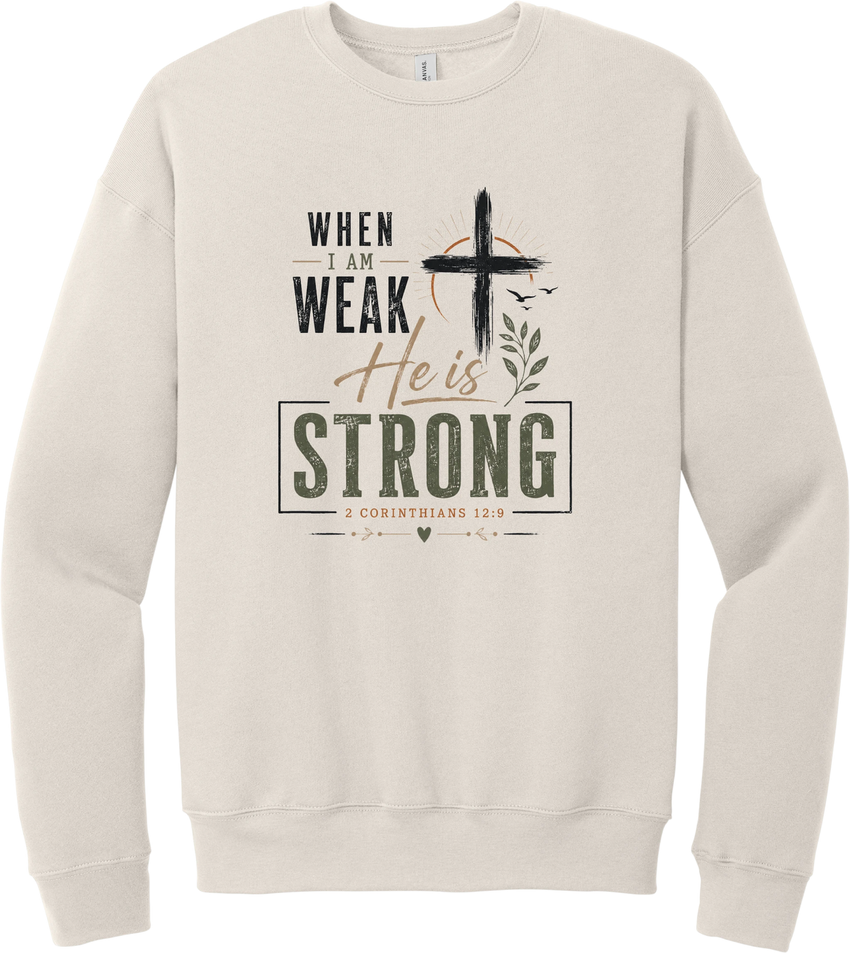 When I Am Weak crewneck sweatshirt in Heather Dust, featuring When I Am Weak He Is Strong lettering with a cross and 2 Corinthians 12:9