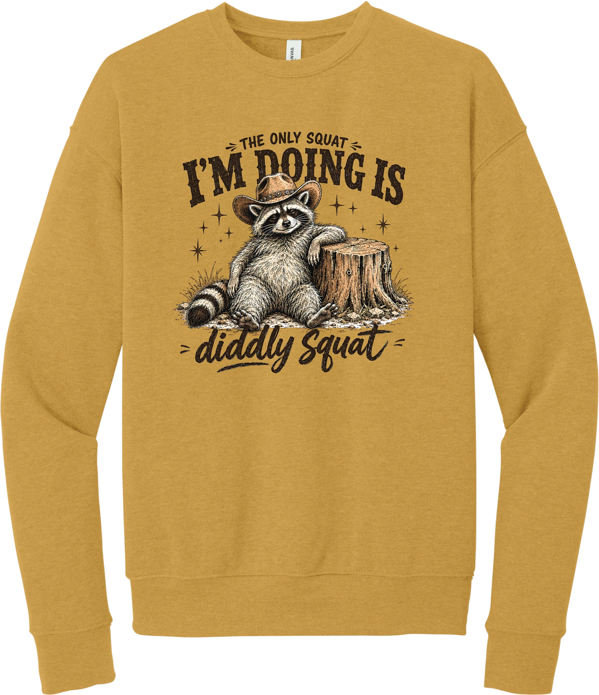 Diddly Squat crewneck sweatshirt in Heather Mustard, featuring a cowboy raccoon lounging against a tree stump with The only squat I'm doing is diddly squat
