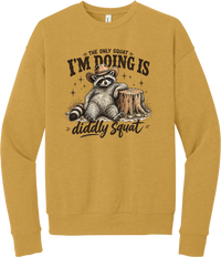 Diddly Squat crewneck sweatshirt in Heather Mustard, featuring a cowboy raccoon lounging against a tree stump with The only squat I'm doing is diddly squat