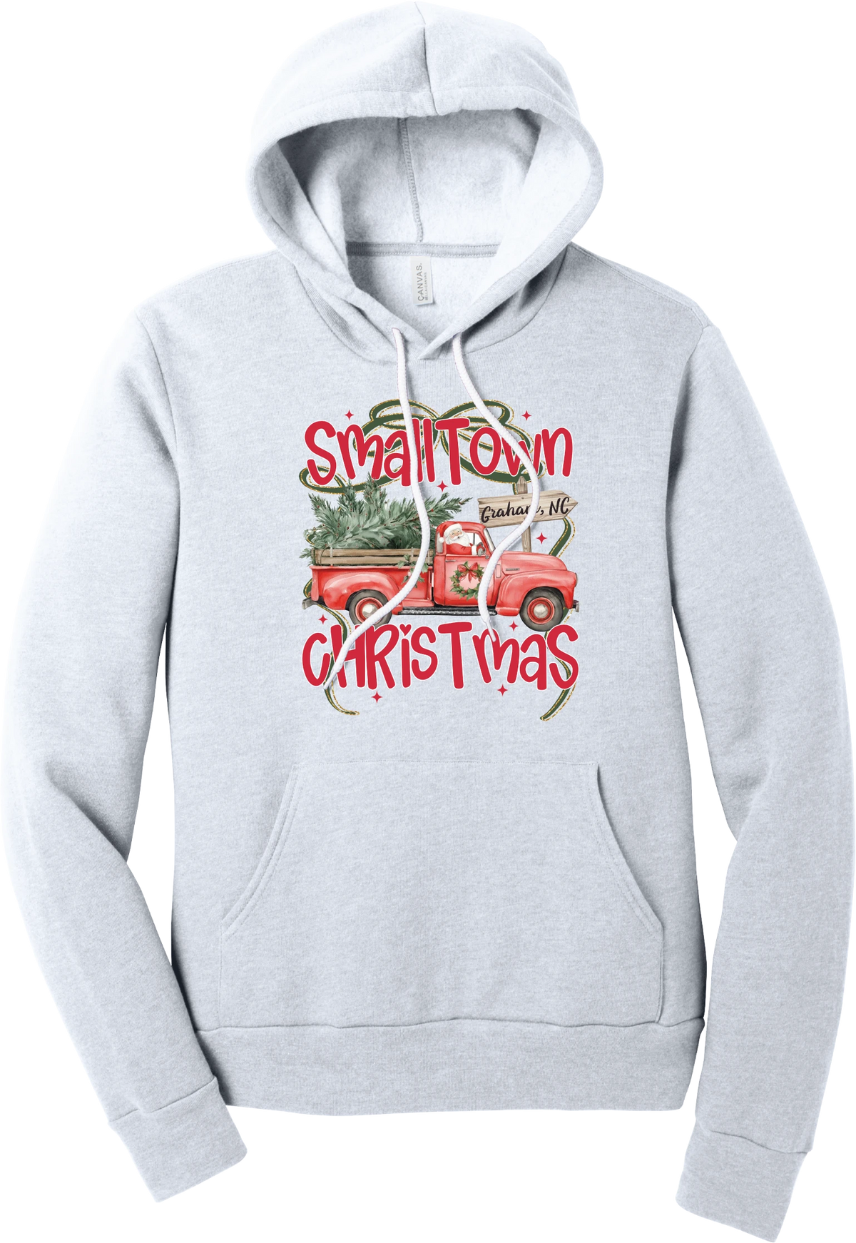 Personalized Small Town Christmas hoodie in Ash, featuring Santa in a vintage red pickup truck hauling a Christmas tree past a personalized town road sign, with red Small Town Christmas lettering