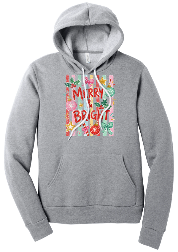 Merry and Bright Striped hoodie in Athletic Heather, featuring red MERRY and BRIGHT letters on pink and green stripes with ornaments and holly
