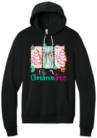 Oh Christmas Tree Cakes hoodie in Black, featuring frosted Christmas tree snack cakes on pink and mint panels over Oh Christmas Tree lettering