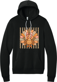 Preppy Turkey hoodie in Black, featuring a smiling turkey with gingham and leopard feathers and a pink bow on a leopard stripe background