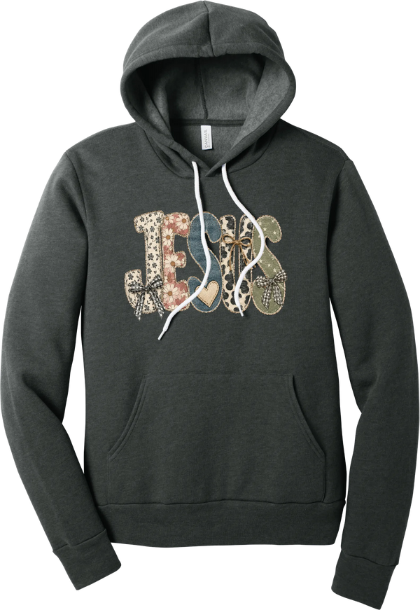 Jesus Patchwork hoodie in Dark Grey Heather, featuring JESUS in patchwork letters of floral, leopard, denim, and cow print with gingham bows and a heart