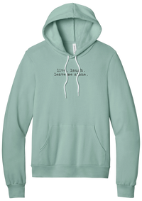 Live Laugh Leave Me Alone hoodie in Dusty Blue, featuring live. laugh. leave me alone. in distressed black typewriter letters