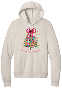 Adore Him Ribbon Tree hoodie in Heather Dust, featuring a colorful ribbon Christmas tree with a pink bow over Oh Come Let Us Adore Him script