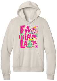 Fa La La Snowman hoodie in Heather Dust, featuring stacked hot pink FA LA LA letters with a snowman, a tinsel tree, gifts, and ornaments