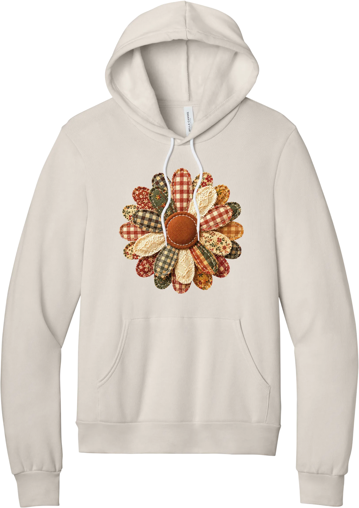 Patchwork Fabric Flower hoodie in Heather Dust, featuring an oversized fabric flower with plaid, gingham, calico, and cable knit petals around a stitched rust center